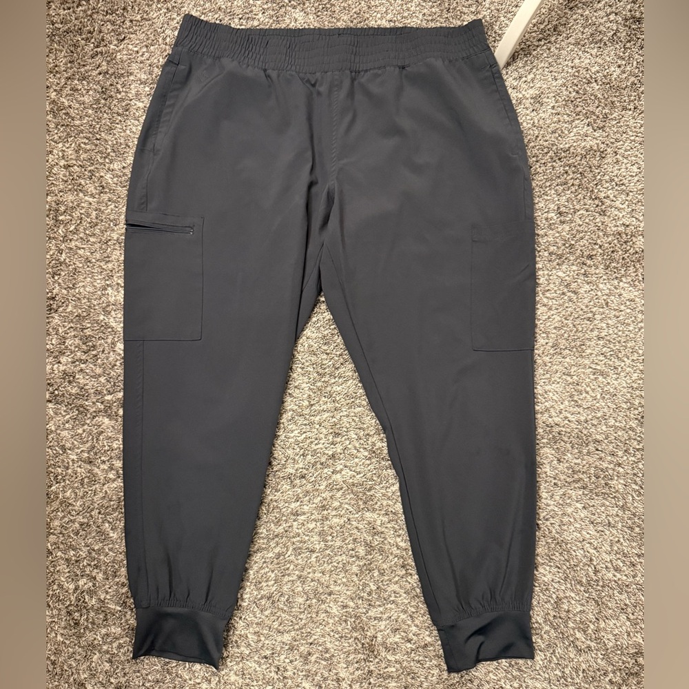 Gently used grey scrub pants with fitted ankle.